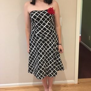 Strapless pin up style dress with red flower
